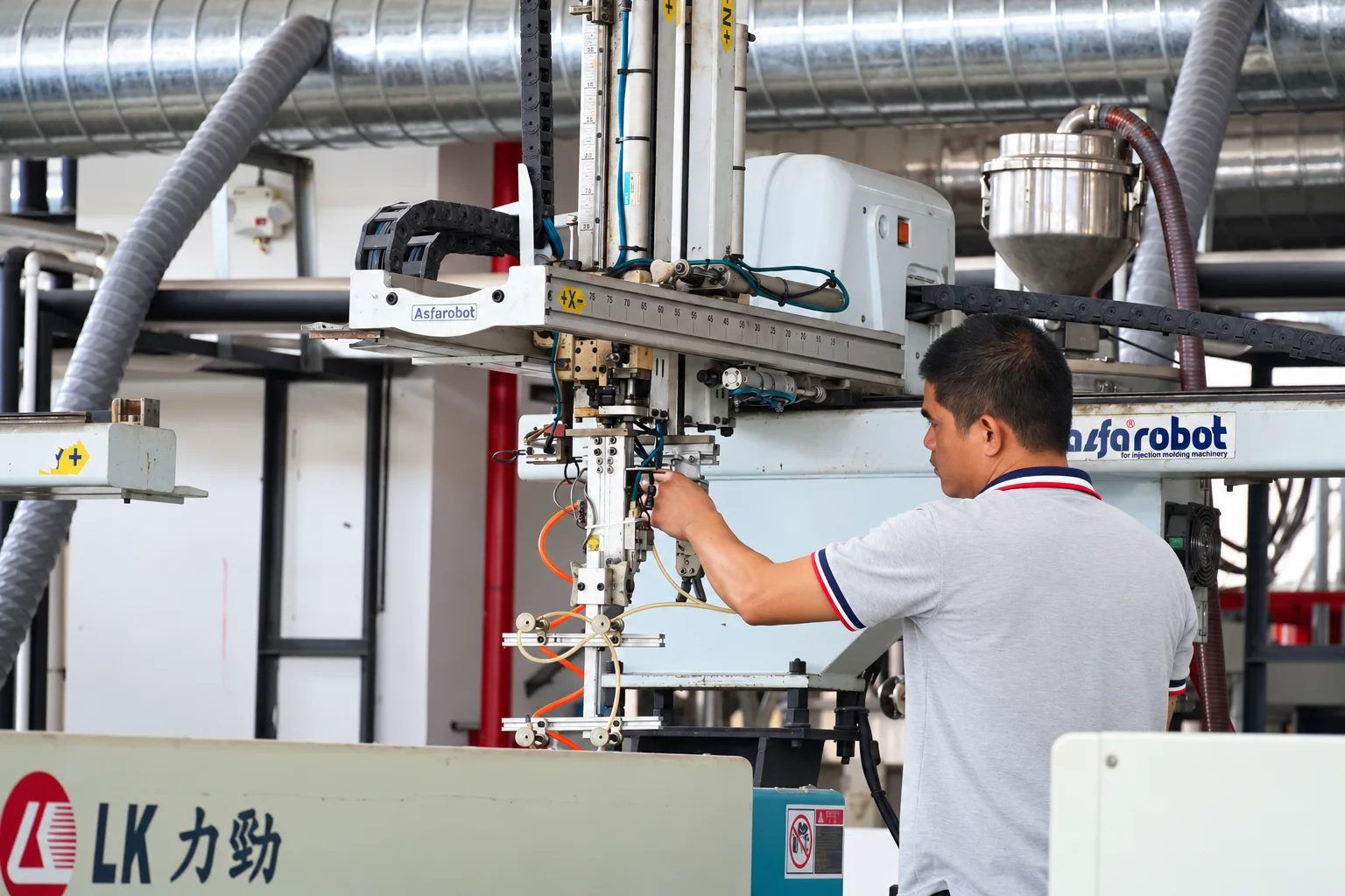 Operator working with automated handling equipment