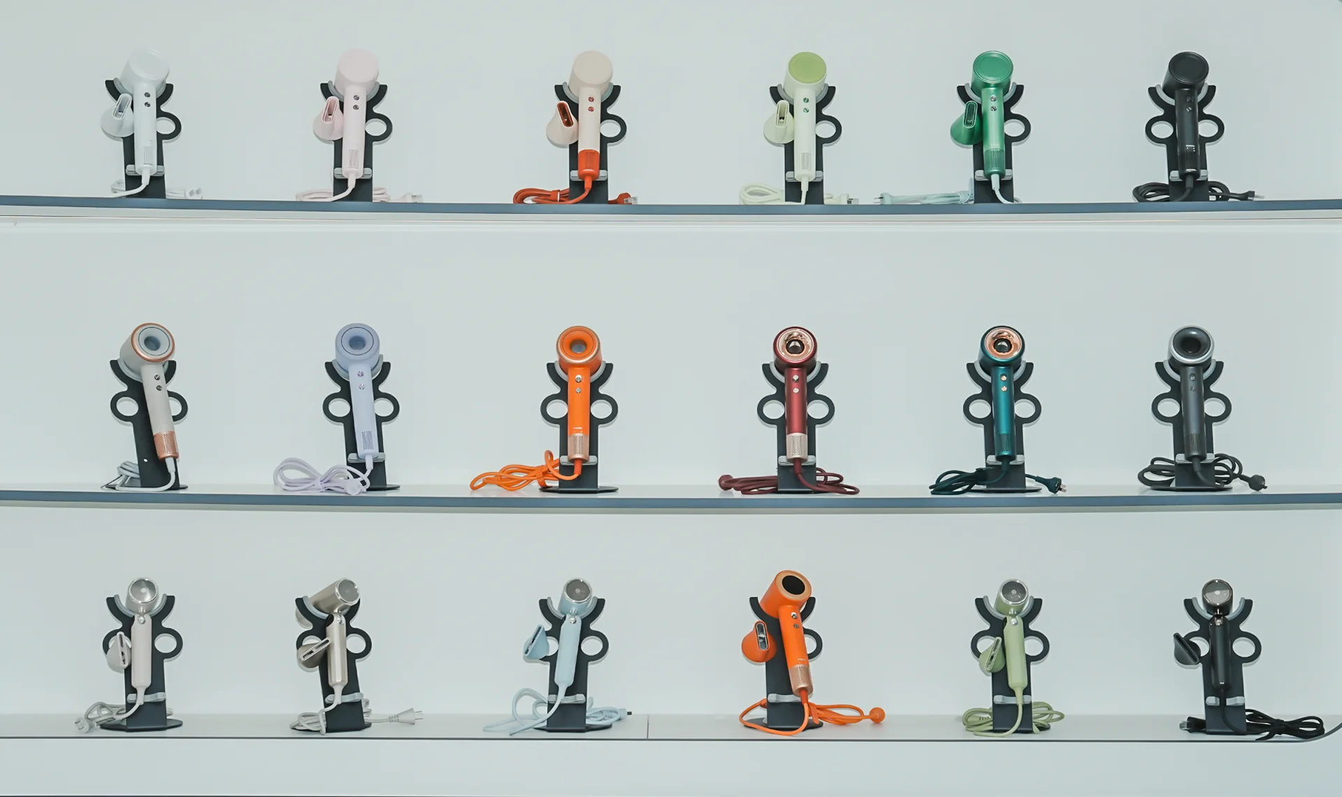 Creade showroom wall displaying hair dryer models and colors